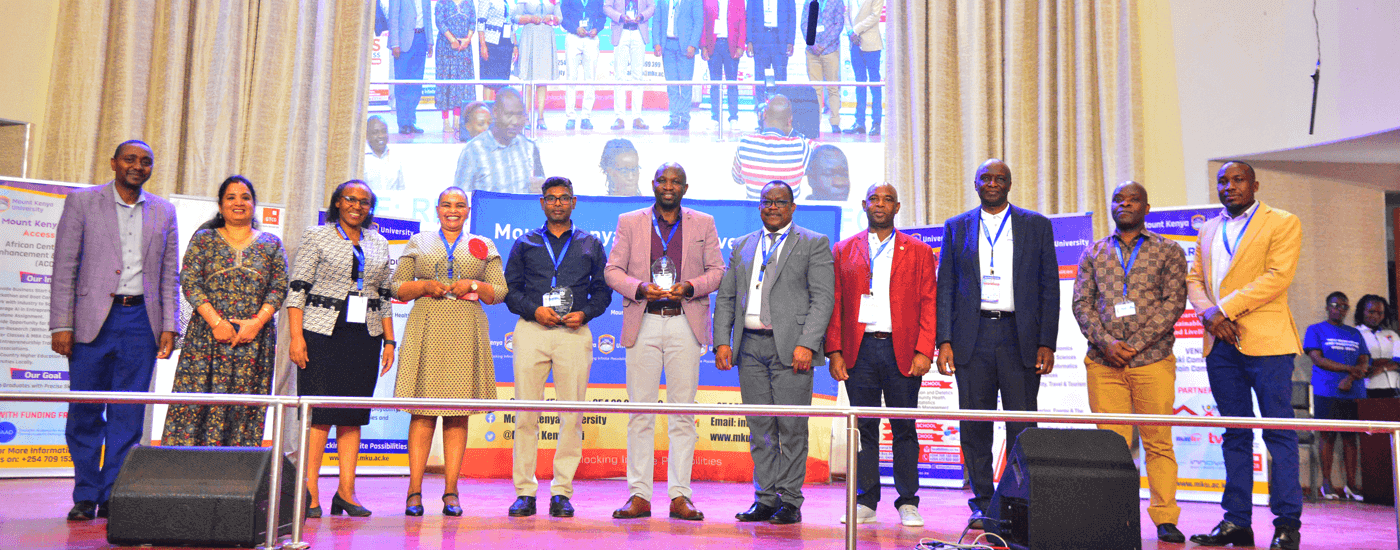 Symposium winners pose for a photo during the award ceremony at Mwai Kibaki Convention Centre