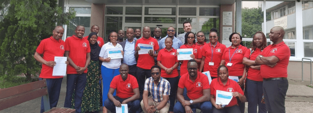 MKU Team together with colleagues from DUCE and UCM in a group photo after receiving certificate of participation during Summer School workshop at UCM, Slovakia